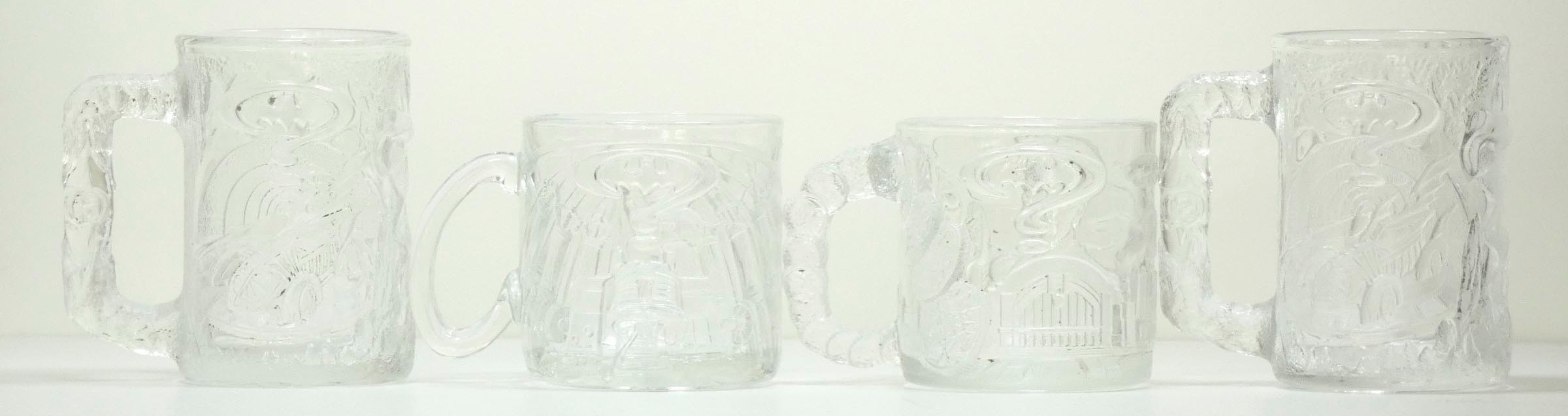 A set of four Batman Forever (1995) glass mugs, available to purchase from McDonalds stores to