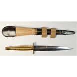 A reproduction Third Pattern Fairburn Sykes fighting knife, with brass ribbed hilt, straight