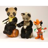 Two drinking panda bear toys, battery operated, picnic bear sat on painted tin log by Alps, Japan