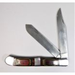 A large Pakistani two blade pen knife, with lacquered wood handle, blades 25cm. This bladed