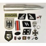 A collection of SS badges, to include Wewelsburg, Kampfbahn Olmutz, silver wire Officers pips, a