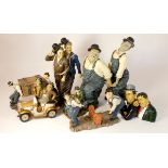 A collection of Laurel and Hardy figures, mostly made from composite plastics and ceramics,