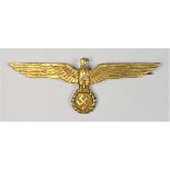 A German WWII Kriegsmarine summer gilt metal breast badge, 9.5cm. The metal breast eagles were