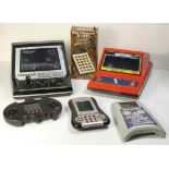 Six electronic handheld devices, five games and a calculator, to include : Scramble Captain