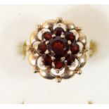 A 9ct gold and garnet cluster ring, K 1/2, 3.5gm