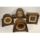 A collection of oak cased mantel clocks and a barometer (2)