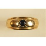 A 9ct gold and black onyx ring, T, 3.9gm
