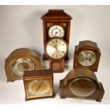 A collection of clocks to include, a Spectrum Quartz-Chime mantel clock, a Coronet wall clock and
