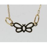 A 14k gold butterfly pendant, 1gm