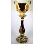 A late 19th continental two handled jardinière on stand, decorated with Art Nouveau flowers and