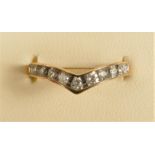 A 9ct gold brilliant cut diamond wishbone ring, stated weight 0.25cts, L, 1.7gm