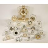 A collection of crystal clocks to include, Waterford, Edinburgh Crystal and others