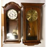 A Hermel wooden wall clock together with another similar and oak cased mantel clocks. (2)