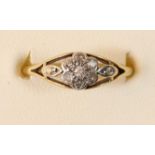 A gold diamond cluster ring, set with single cuts, O 1/2, 2.3gm