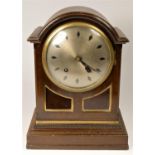 An oak cased mantel clock, striking, with arched top, and diamond hour mark dial, 34 x 27 cm