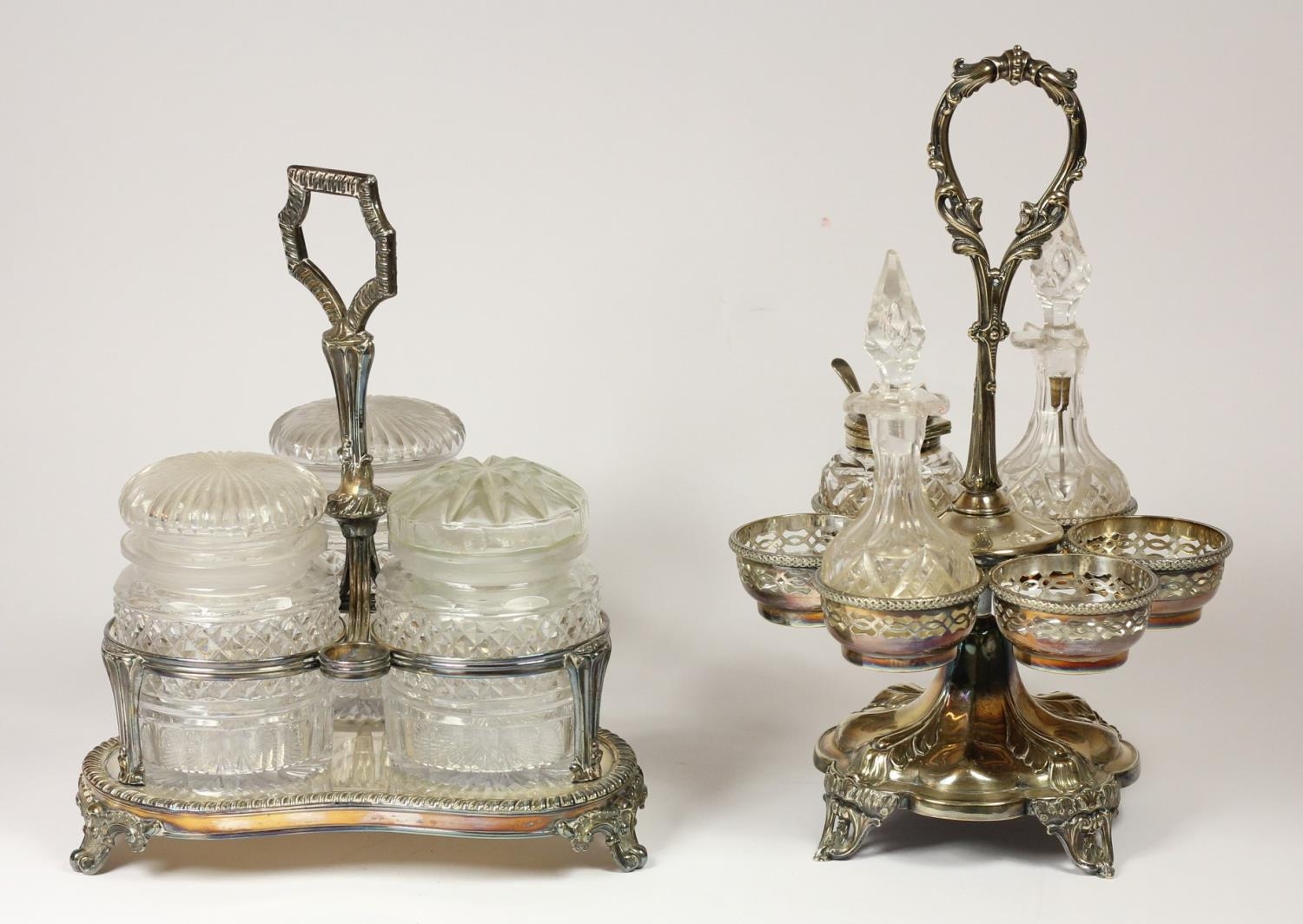 A Victorian Sheffield Plate three bottle lidded preserve jar stand, with cut glass jars, one cover