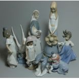 A Lladro figure of a lady with a lamp impressed mark 4582, another of a clown with a puppy , 5278,