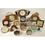 A collection of clocks to include a Swiss silver cased pocket watch, an enamel Smiths alarm clock,