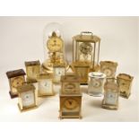 A collection of clocks to include, quartz carriage clocks, oak cased mantel clocks and others (2)