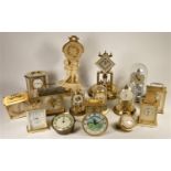 A collection of quartz carriage and anniversary clocks to include, Rhythm, Kundo, Smiths and