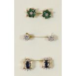 A 9ct gold pair of emerald and diamond ear studs and two other 9ct gold examples