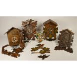 A collection of five cuckoo clocks