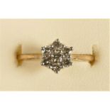 A 9ct gold brilliant cut diamond cluster ring, stated weight 0.25cts, N 1/2, 1.8gm
