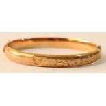 A 9ct rose gold bangle, 8.5gm