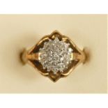 A 9ct gold and diamond cluster ring, stated weight 0.25cts, M, 3gm