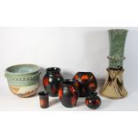 Five pieces of galaxy pattern Poole pottery to include, a purse vase and four smaller vases,