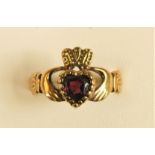 A 9ct gold and garnet Claddagh ring, T, 2.8gm