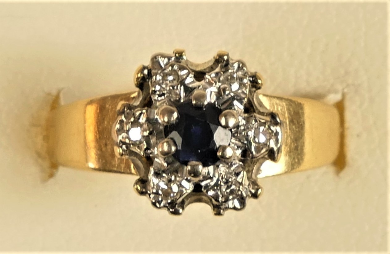 An 18ct gold sapphire and diamond cluster ring, K, 2.4gm