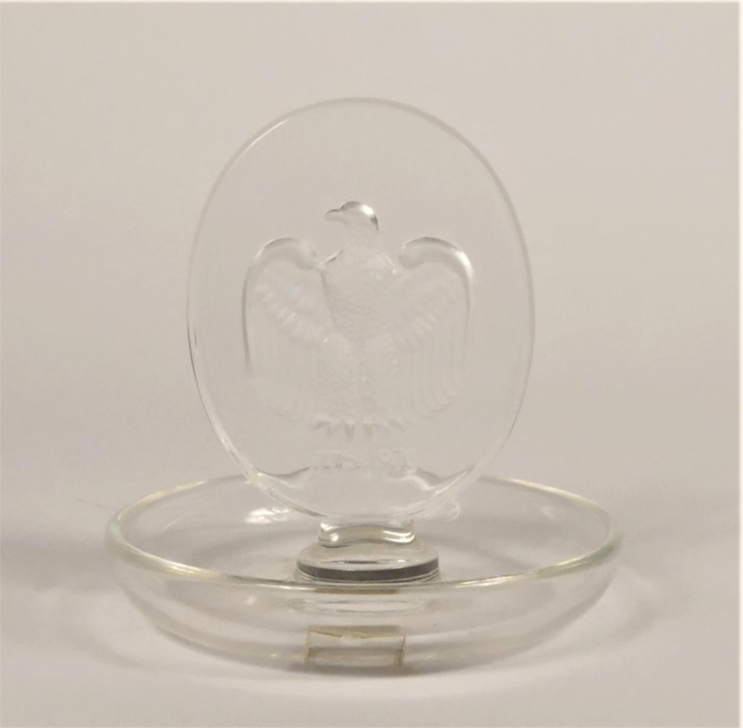 A Lalique bicentennial pin dish, decorated with American eagle 1776-1976, ht 9.5cm, signed, original