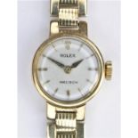 Rolex Precision, a 9ct gold manual wind ladies wristwatch, London 1958, the silvered dial with baton