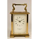 August Schatz & Sons, a German brass 1/2 hour striking carriage clock, the white enamel dial with