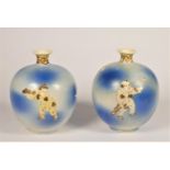 A 19th century pair of Japanese powder blue vases, unmarked, decorated with men playing a stick