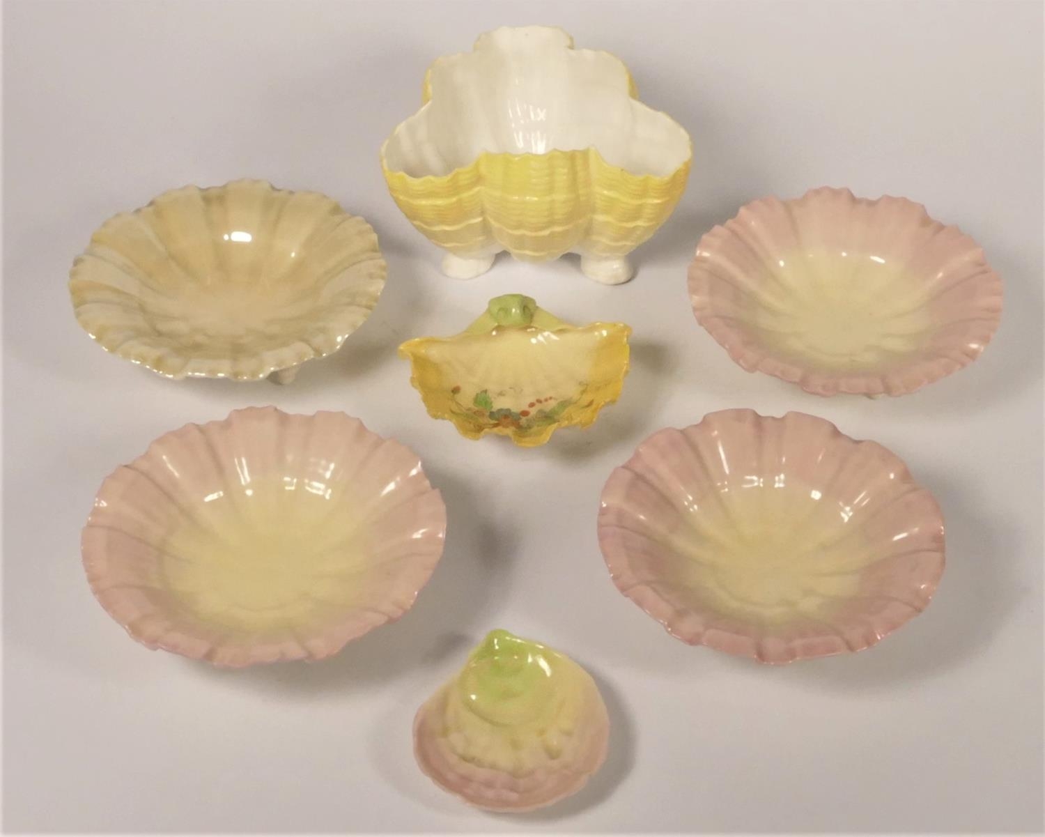 A Royal Worcester set of four shell bowls, pattern G 180, diameter 12cm, a small shell bowl, G677,