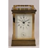 L'Epee, France, a brass alarm time piece, the white enamel dial with Roman numerals, over a