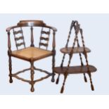 An Edwardian oak corner chair with cane seat and shaped splats, together with a folding cake