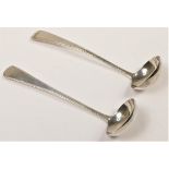 A George III Scottish silver pair of feather edge toddy ladles, by Alexander Henderson, Edinburgh