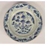 A Chinese Qing blue and white plate with tree decoration, diameter 22.5cm, riveted.