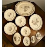 An Edwardian Wedgwood Etruria botanical part dinner service, stamped Wedgwood, Made in England, over