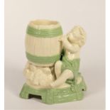 A Royal Worcester figural spill vases, in the form of a cherub and barrel, impressed mark, 14cm