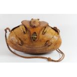 A lady's shoulder bag of rugby ball shape formed from a lined armadillo skin with head and limbs,