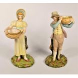 A Royal Worcester pair of figural spill holders, designed by James Hadley in the Kate Greenaway