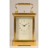 Garrard, London, a brass 1/2 hour striking and repeating carriage clock, the white enamel dial