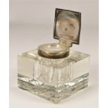 A silver mounted cut glass square inkwell, Birmingham 1938, the hinged cover with engine turned