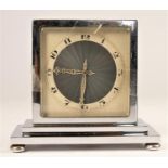 An Art Deco chrome 8 day double sided mantle clock, unsigned, Roman numerals, raised on four ball