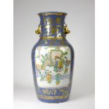 A Qing dynasty powder blue famille rose baluster vase, with "bag of rice rim", with two panels of