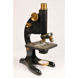 Beck Ltd, London, a compound microscope, Model 29, finished in black lacquer with brass parts, case.